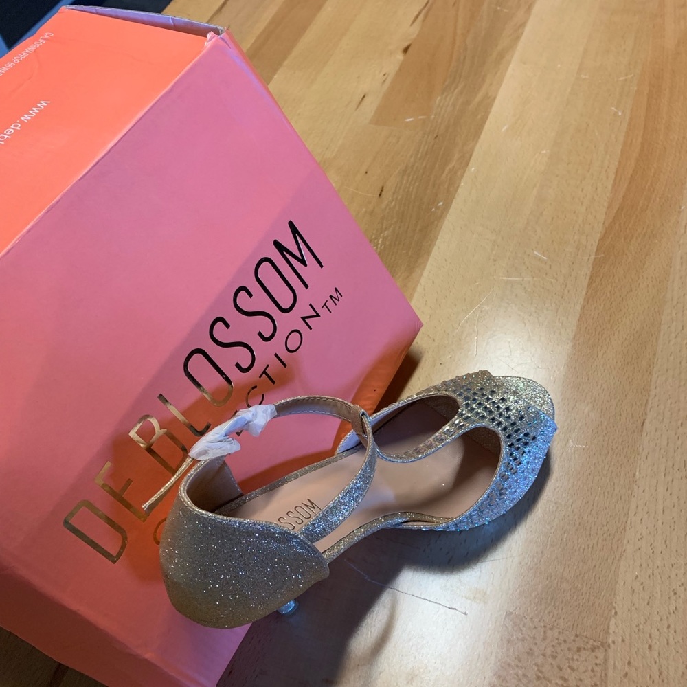 Elegant, embellished open toe heel.